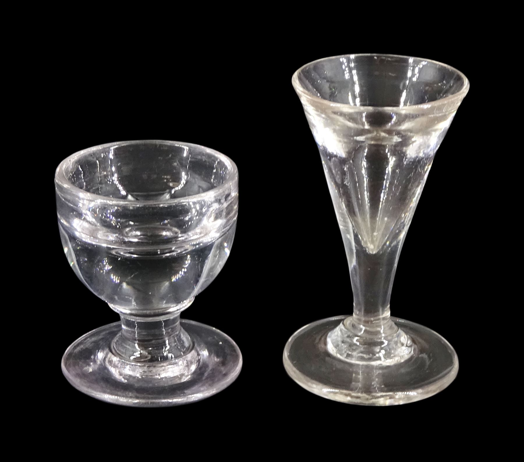 19th century toastmasters glass, the trumpet bowl upon firing type foot, H10cm, together with a further 19th century toastmasters/ penny lick type glass with deceptive rounded bowl upon firing type foot, H7cm