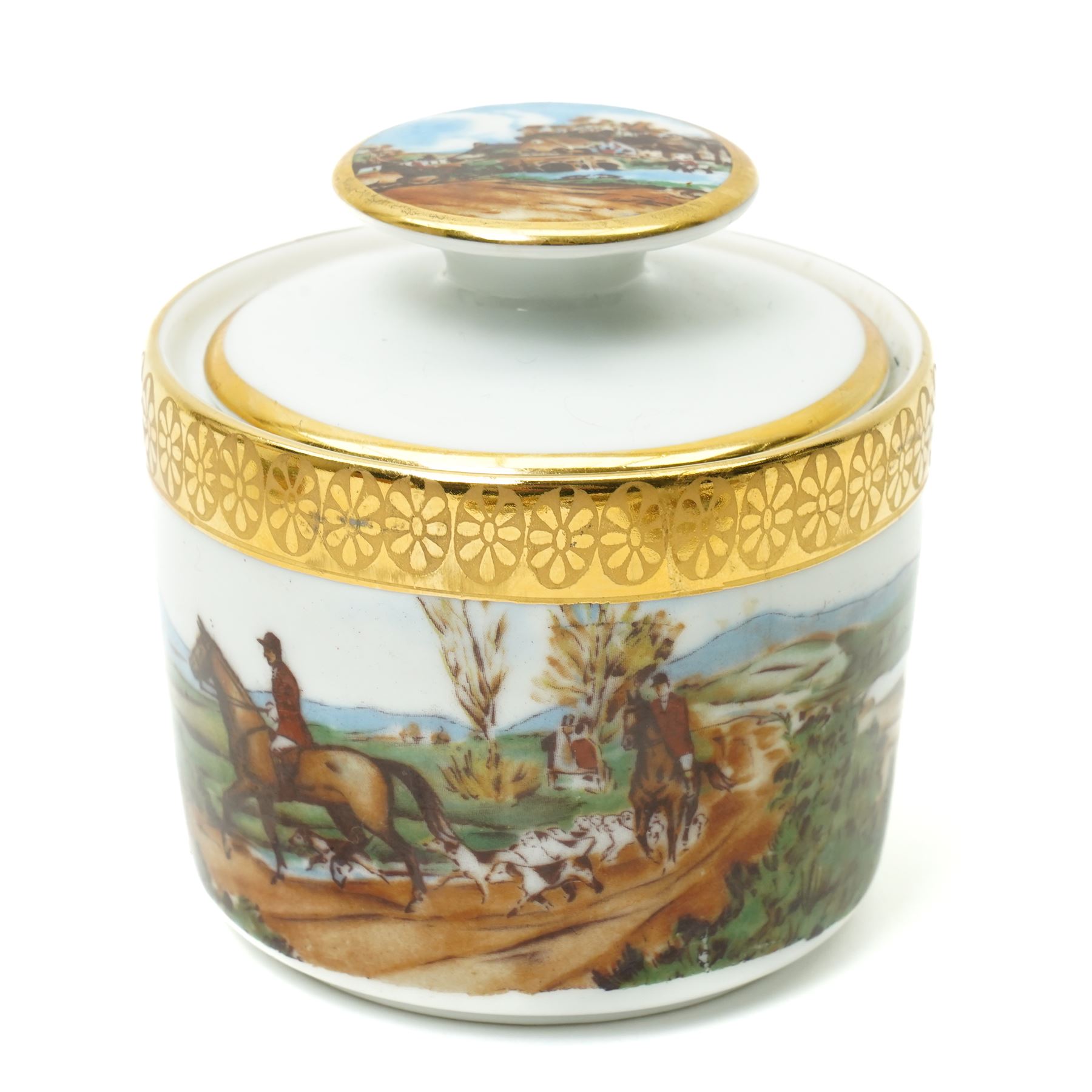 Limoges  coffee set decorated with hunting scenes within a gilt border comprising twelve cups and saucers, coffee pot, cream jug and sugar bowl