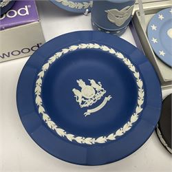 Collection of Wedgwood Jasperware, to include black Eisenhower Bust, two black basalt paperweights, one depicting an eagle and one depicting Julius Caesar, a blue Zodiac plate, Man on the Moon commemorative plate, American Independence Bicentennial plate and Royal commemorative ware, etc, all with impressed marks beneath, some with boxes