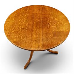 Traditional design golden oak tilt-top tripod table, brass fittings, turned baluster column on splayed supports