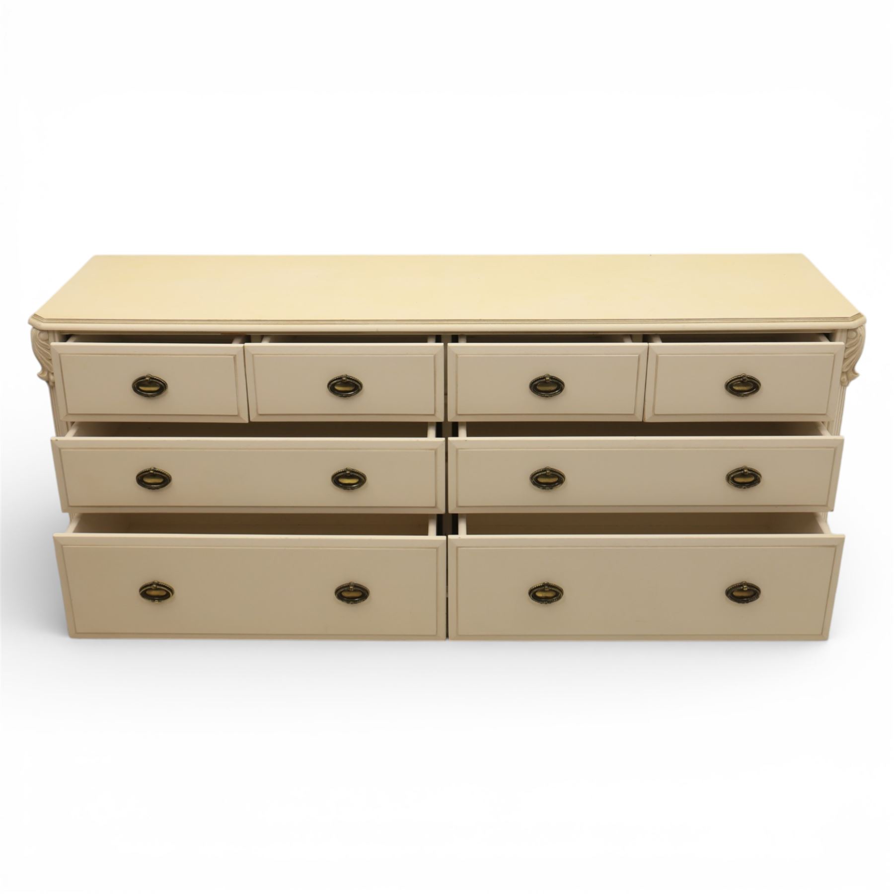 Contemporary French design white painted bedroom suite retailed by Barkers of Northallerton, comprising wide chest fitted with four short and four long drawers with oval brass handles (H 70cm, W 159cm, D 46cm), pair of bedside chests each fitted with three drawers (H 62cm, W 40cm, D 46cm), dressing table fitted with four short drawers and central kneehole with shaped apron (H 79cm, W 131cm, D 46cm) with matching framed wall mounted mirror (H 100cm, W 113cm), and full length standing mirror (H 175cm, W 73cm)