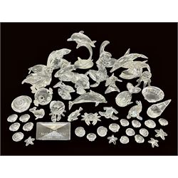 Nineteen Swarovski Crystal sea creatures, to include dolphins, seals, puffer fish, octopus, crabs, together with a quantity Swarovski Crystal shells 