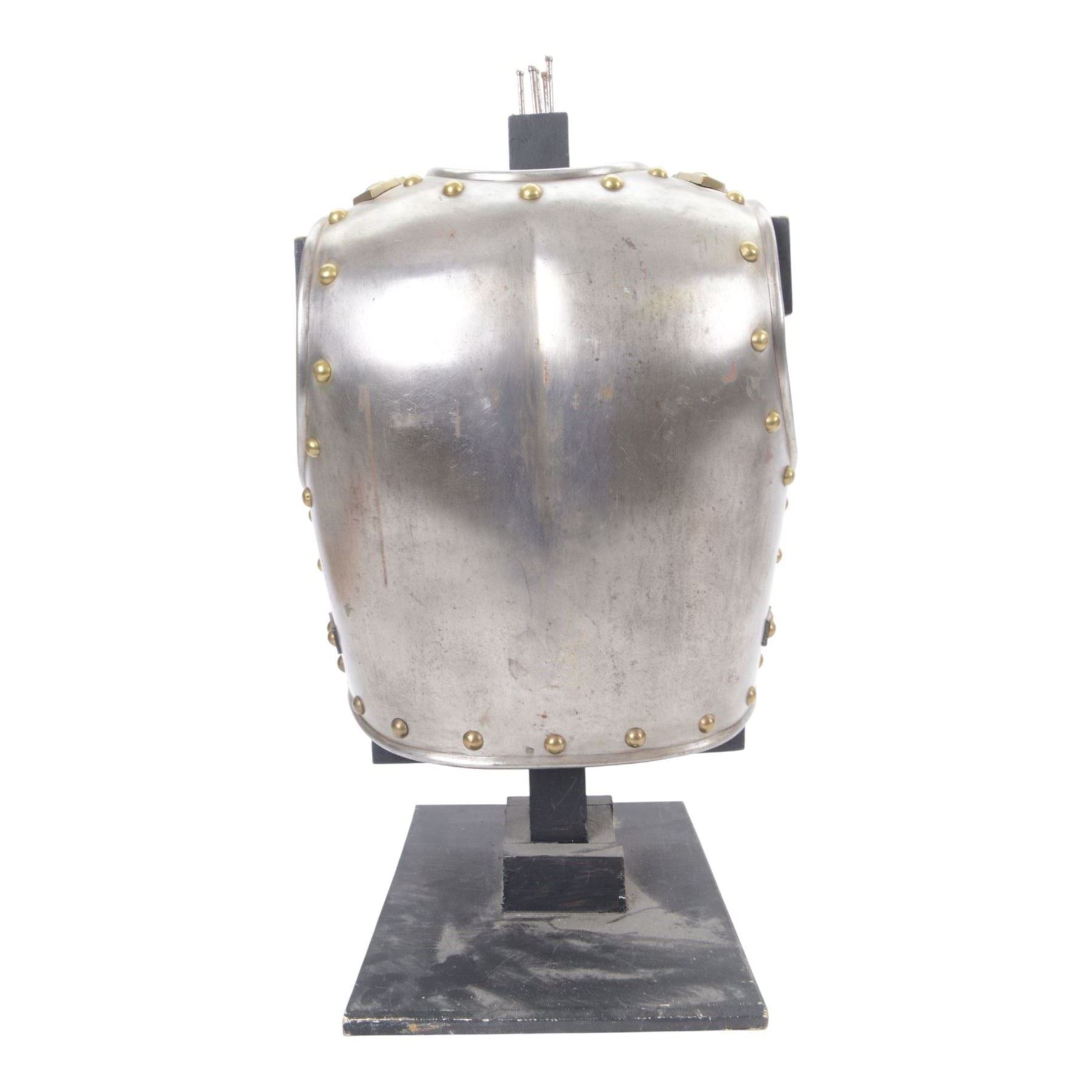 Napoleonic Belgium Cuirassier breast and back plate, circa 1814, with raised medial ridge and shallow apron, rolled edge and brass studded decoration, the shoulder chains secured by chest studs, H40cm