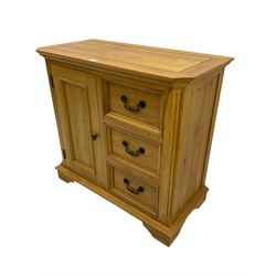 Light oak side cabinet, fitted with single cupboard and three drawers