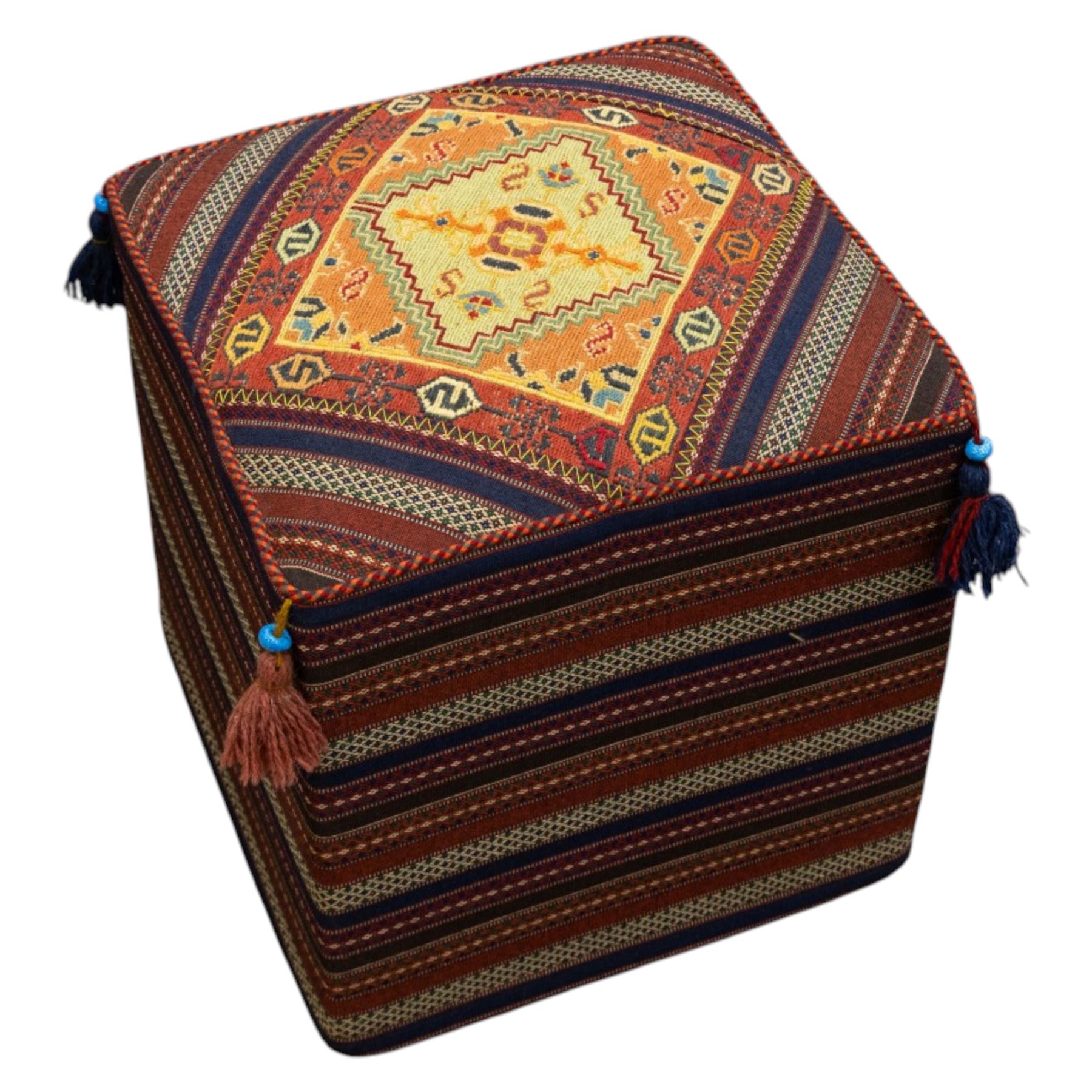 South West Persian Qashqai stool, square flatwoven top with central geometric medallion enclosed within a stepped border the sides decorated with striped bands of geometric motifs with tasselled corners 
