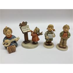 Twenty six Hummel figures by Goebel, to include Christmas Treat, Drummer boy, Gone a Wondering, Spring Cheer etc