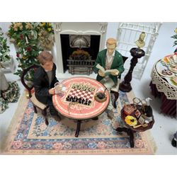 Dolls house furniture, including pianos, fireplace, plants, flower arrangements, tables, chairs, six figures and a collection of instruments and other accessories
