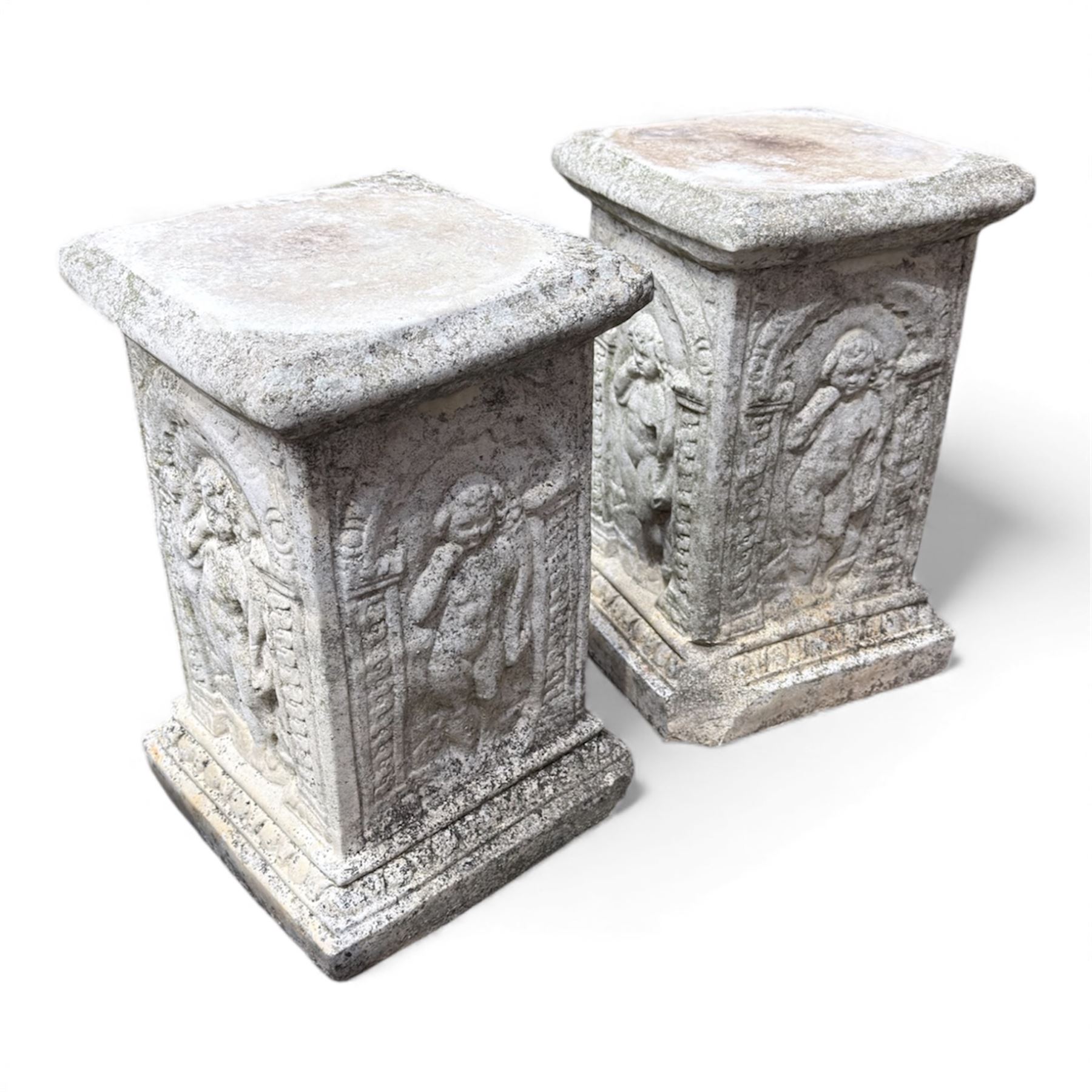 Paid of square cast stone plinths with a classical design
