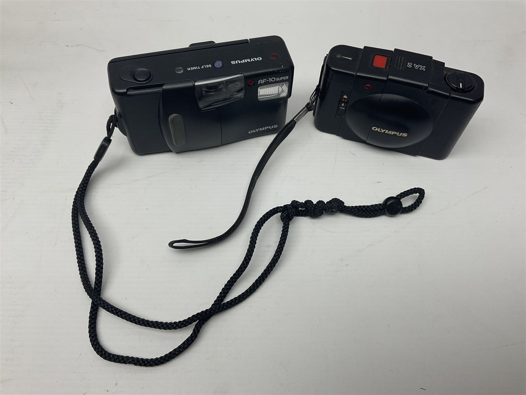 Four Olympus cameras, to include AF10 Super, XA2, Shoot & Go and Supertrip examples, together with Miranda ME-Z and Miranda ME-X DX cameras, an Agfa Optima camera with Agfa Paratonic DIN ASA Solitar 1:2.8/40 lens, Canon Snappy S camera and a Fujifilm Fine Pix S5700 camera, serial no 7WE12368 (8)