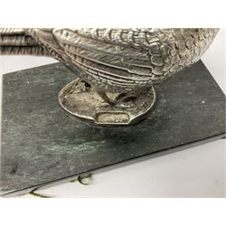 Group of silver, to include filled figure of a pheasant, hallmarked for London, pair of silver mounted horn napkin rings, miniature Edwardian bible with silver cover embossed with putti, Victorian silver brooch, ebonised plinth with applied inscribed silver shields, etc., together with two stick pins, one example with 9ct gold terminal 