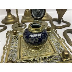 Brass inkstand, of square form, pierced, inset with blue and white ceramic inkwell to centre, together with a collation of brass candlesticks 