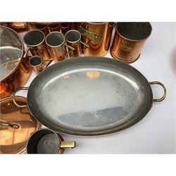 Set of three graduating copper sauce pans with covers, with wooden handles and brass detailing, together with a copper culinary mould depicting a cockerel, four graduating frying pans, colander, kettle, tool holder and two grain pots, etc