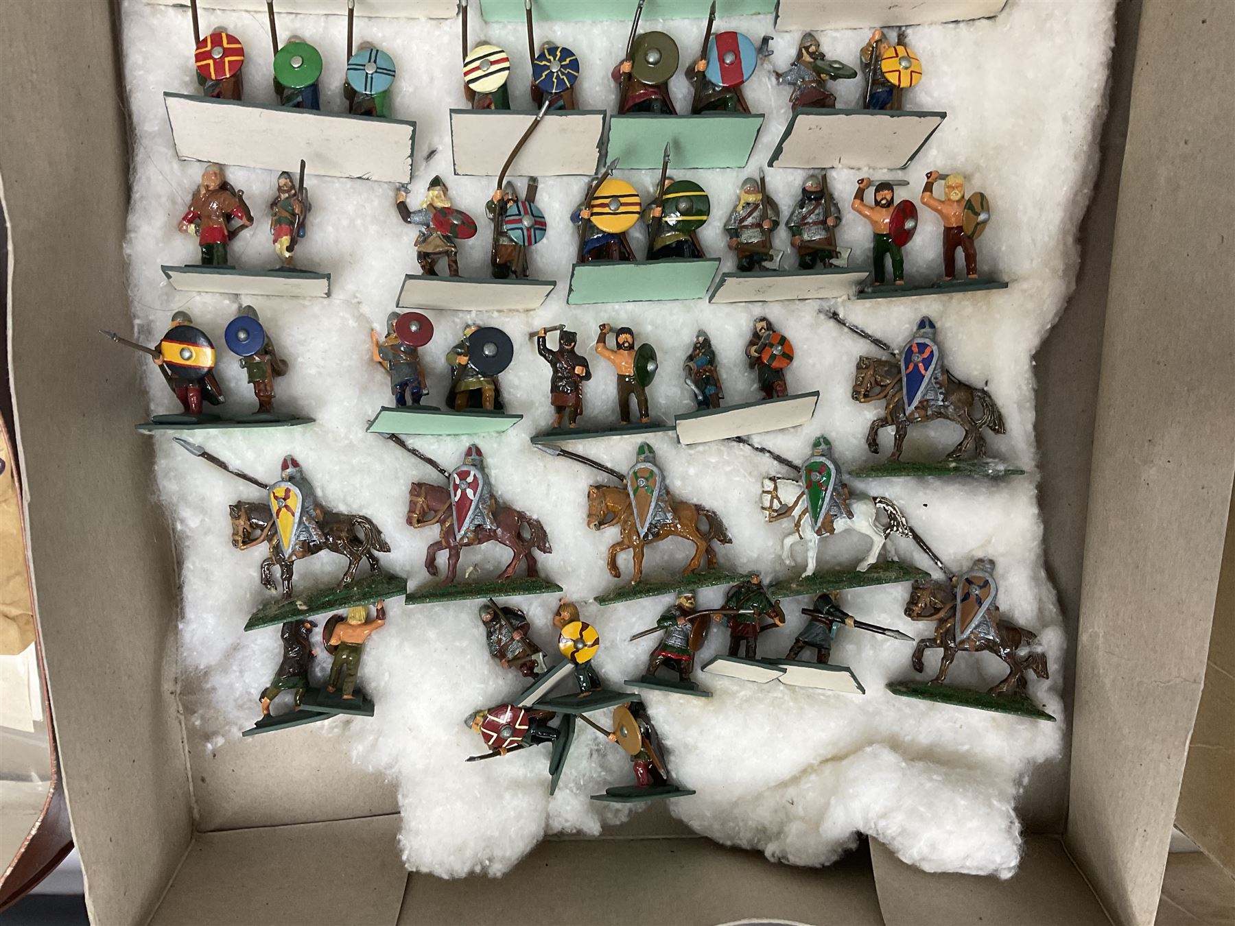 Painted metal wargame figures - over four hundred including Normans and Saxons, Romans, British Tribes etc; together with a quantity of part-painted and unpainted figures, battlefield weapons and accessories etc; average size 25mm
