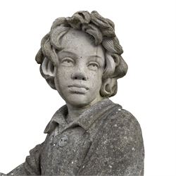 Haddonstone - weathered cast stone garden statue of a boy holding a basket of grapes, modelled with curled locks of hair wearing a tunic and breeches leaning against a naturalistic tree stump, on square base