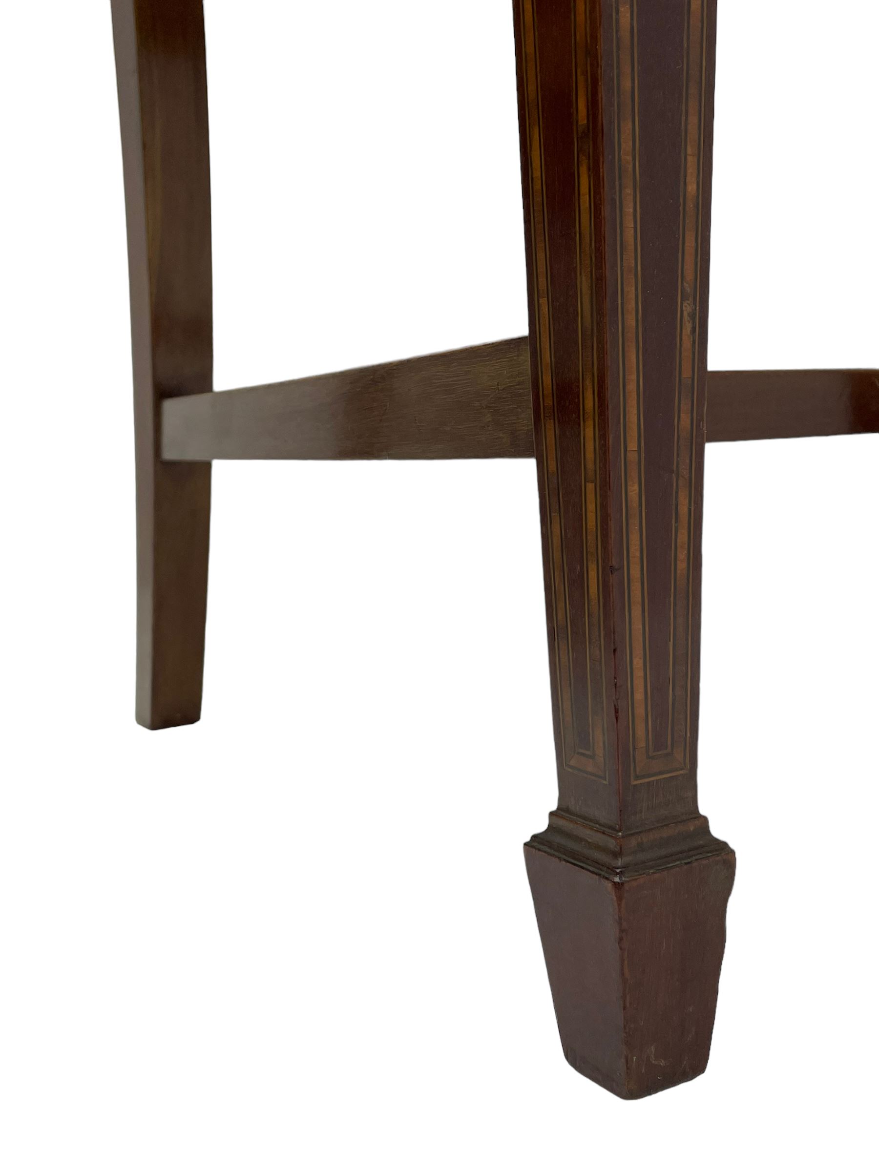 Set twelve (4+8) Edwardian inlaid mahogany dining chairs, cresting rail with satinwood banding, pierced splat backs with central inlay, drop-in seats upholstered in foliate patterned ivory fabric, raised on square tapering supports terminating in spade feet