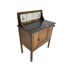 Edwardian oak washstand, raised back with tiles and marble top, fitted with single panelled cupboard door

