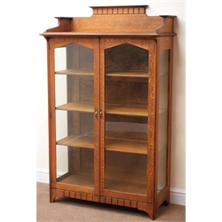  Early 20th century oak Arts and Crafts display cabinet, raised back, moulded top, two glazed doors enclosing three shelves, stile supports, W94cm, H155cm, D43cm   