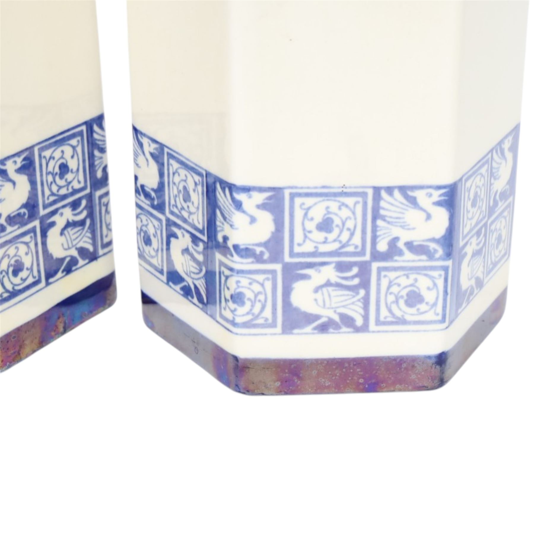 Pair of 1920's Art Deco Royal Doulton lustreware hexagonal vases, with boards of checkerboard design of alternating bird and scroll motifs, designed by Reco Capey, H28cm