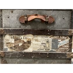 Early 20th century wood and metal bound zinc travelling trunk, hinged top with three clasps, decorated with period luggage labels