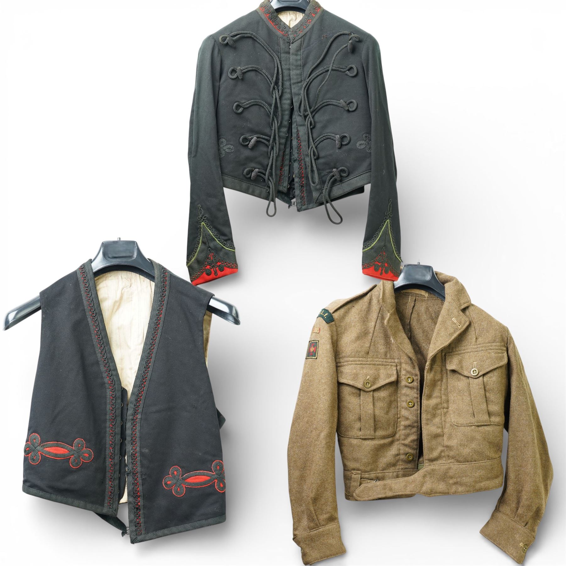 Kings Shropshire Light Infantry 1949 pattern tunic with Croix de Guerre flash and a Rifle Officer's mess tunic and waistcoat with green facings (2)