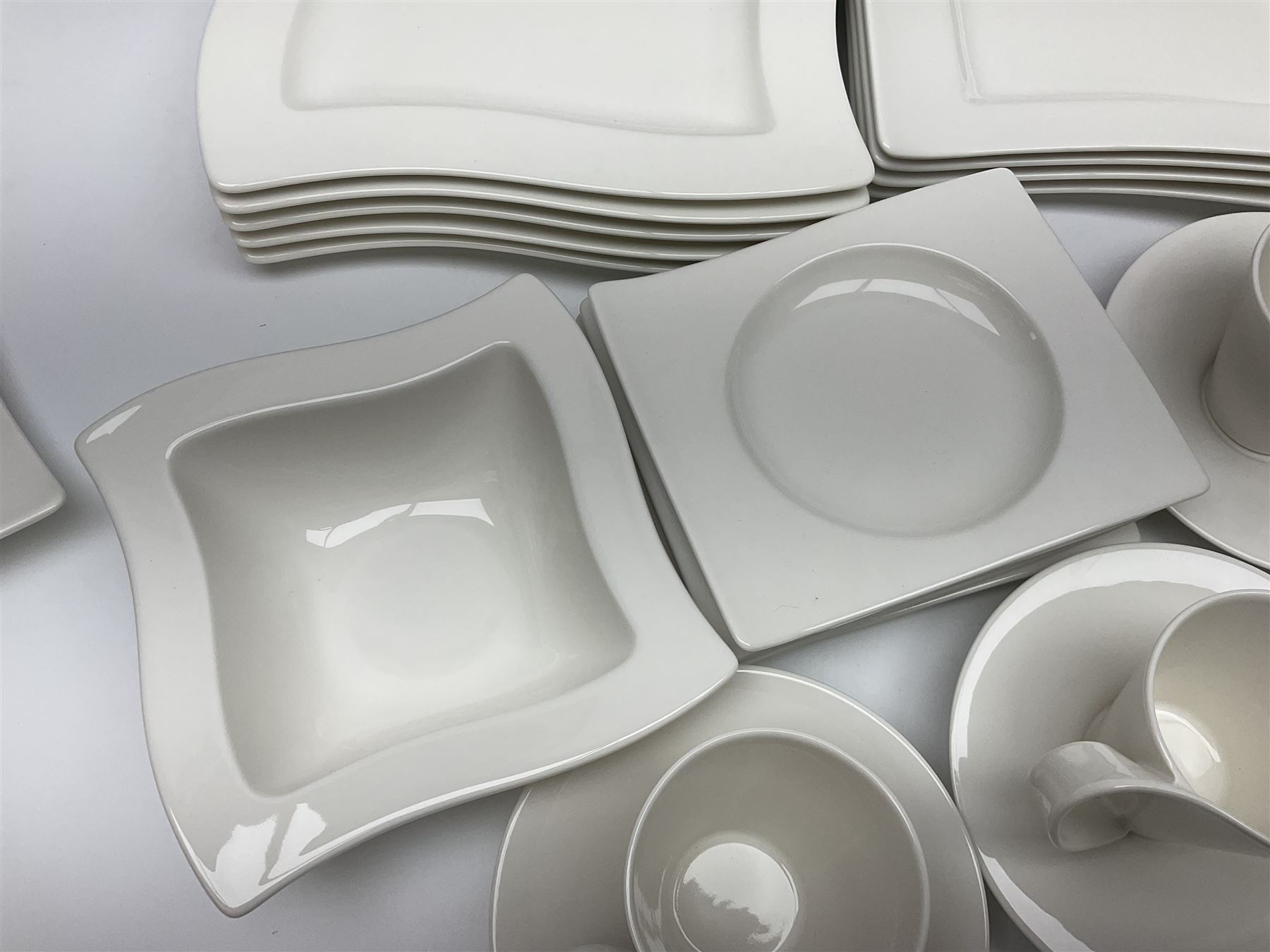 Villeroy & Boch New Wave pattern dinner and tea service for five people, comprising square dinner plates, rectangular dinner plates, pasta bowls, cereal bowls, coffee cups and saucers, side plates and dessert plates, all with printed mark beneath