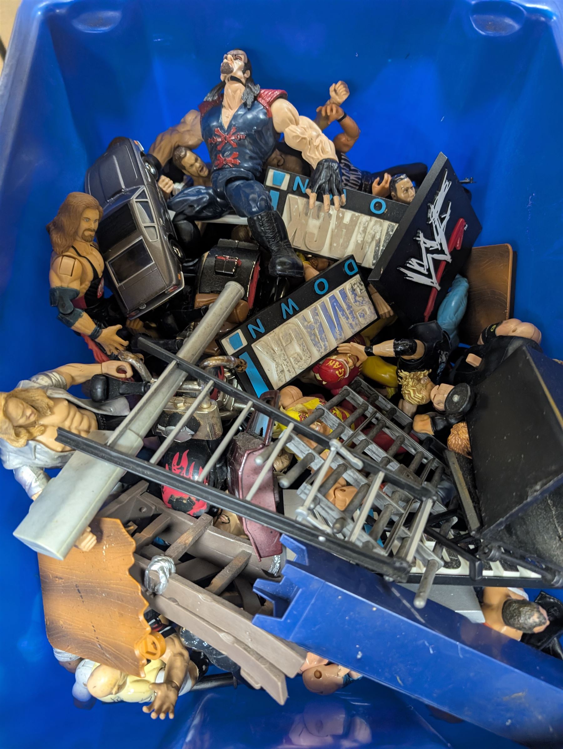 Collection of wrestler figures, two WCW Road Rebels vehicles and a collection of accessories