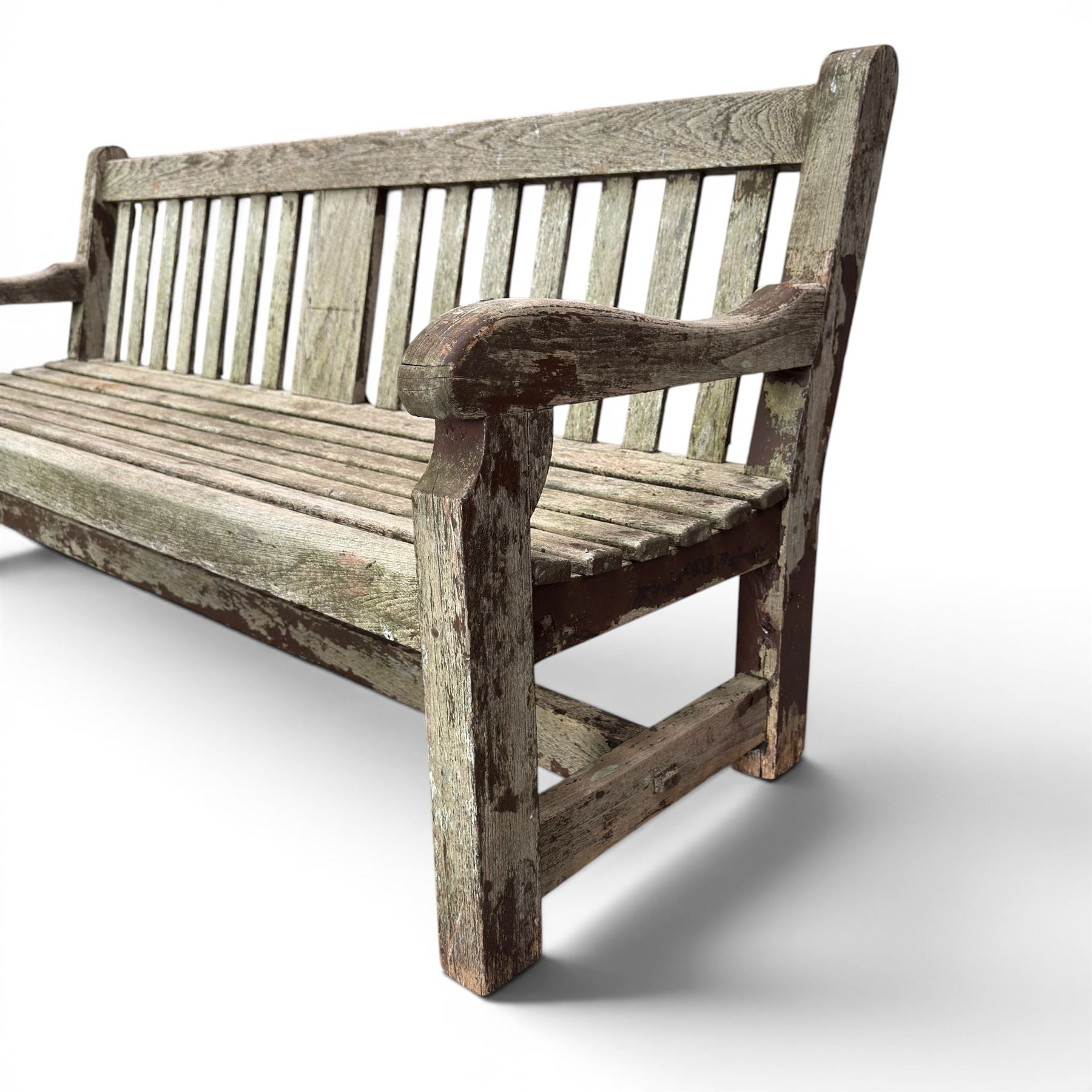 Teak garden bench with slatted back and seat raised on square supports