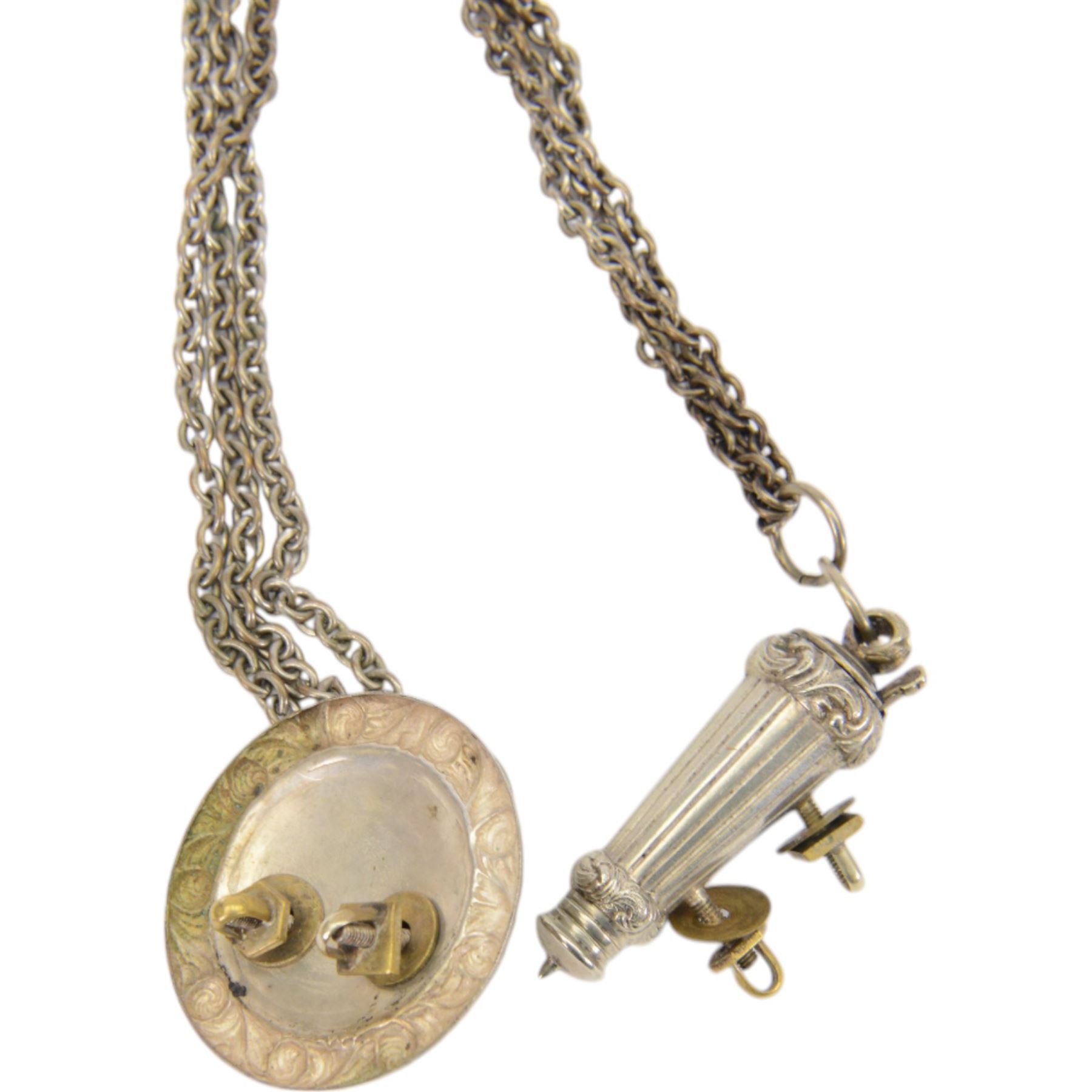 British Officers cross belt fittings, consisting of lion head boss badge with chain leading to whistle in  flute holder