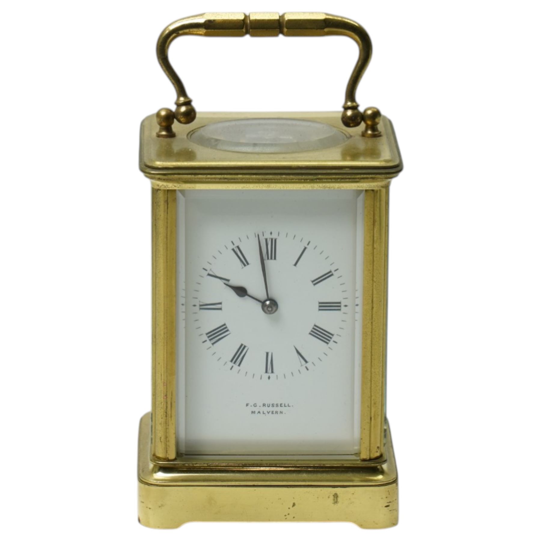 Early 20th century carriage clock, the white enamel dial inscribed F G Russell, Malvern with bell strike in brass and bevelled glass case H12cm