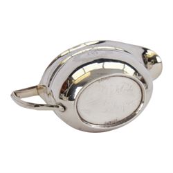 George III silver three piece tea service, comprising teapot with ivory scroll capped curved handle and ivory finial to the hinged cover, twin handled open sucrier with gilt interior, and cream jug with gilt interior, each of oval form with rounded sides, the bodies engraved with central monogram within a seaweed wreath, between engraved foliate bands, hallmarked John Emes, London 1801, teapot including handle H17cm

This item has been registered for sale under Section 10 of the APHA Ivory Act