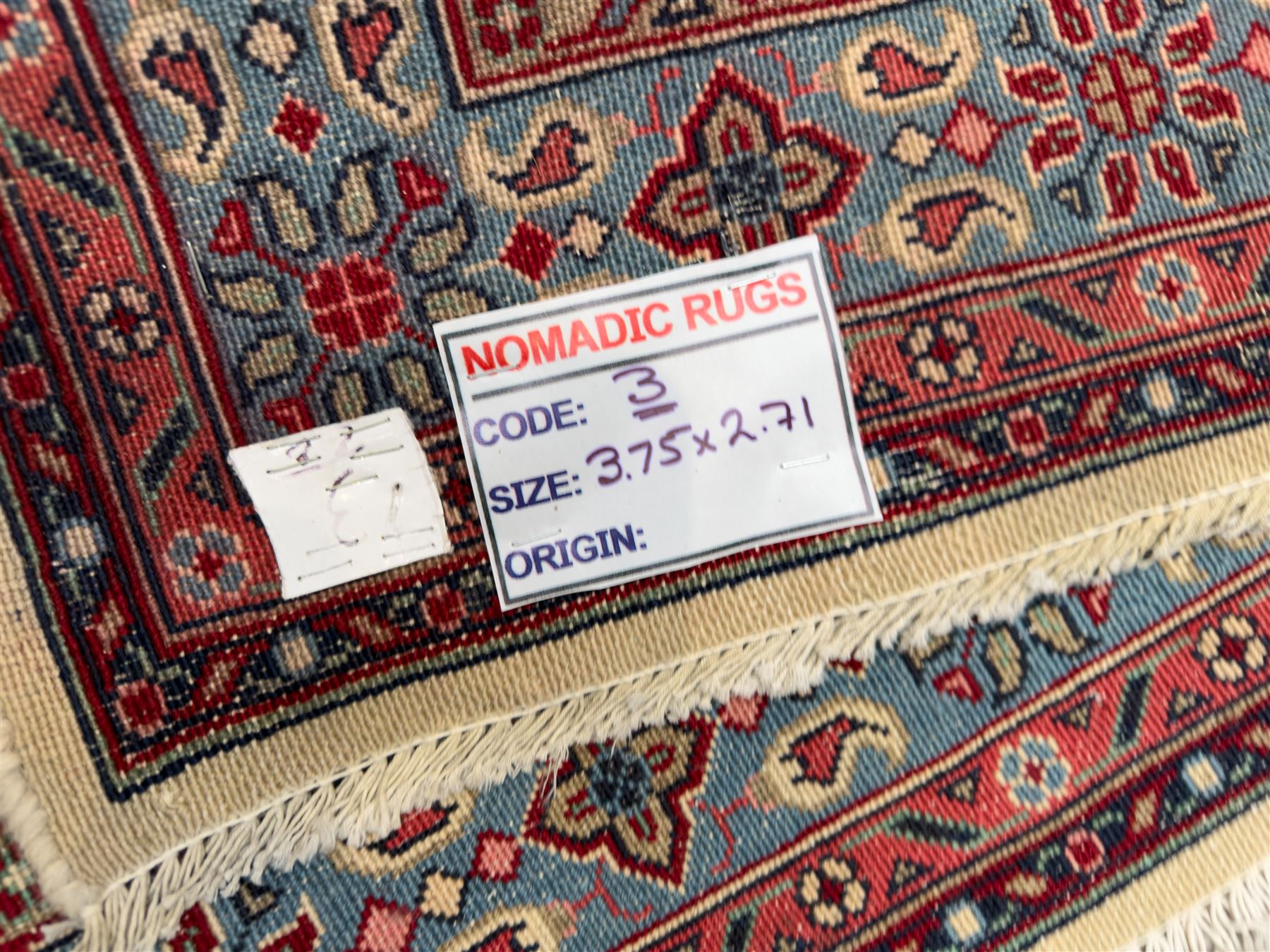 Northwestern Persian Hamadan carpet, hand-knotted, ivory field with an all-over Herati design of rosettes and serrated leaves within multiple borders, madder red with angular vine and rosette motifs, 375cm x 271cm 