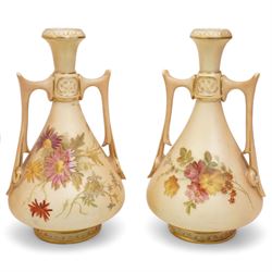 Royal Worcester blush ivory porcelain to include a pair of jugs, no. 1094, pair of vases, no. 1021, and a small ewer no. 1094 (5)