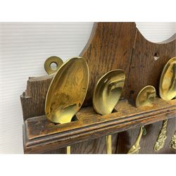 George III oak spoon rack and candle box, the rectangular backplate with shaped  pediment and two six aperture spoon racks, above a candlebox with hinged cover, with various brass spoons and a pair of brass candle snuffers, H56.5cm, W35cm, D14cm 