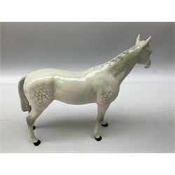 Collection of Beswick horses, including grey horse no.701, palomino foal no 836, grey stocky jogging mare no.855 etc, together two Royal Doulton horses, (8)