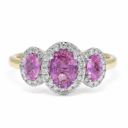 18ct gold pink sapphire and diamond trilogy ring, three oval cut sapphires surrounded by r...