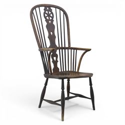 19th century Provincial wheelback Windsor armchair, high stick back, saddle seat on four t...