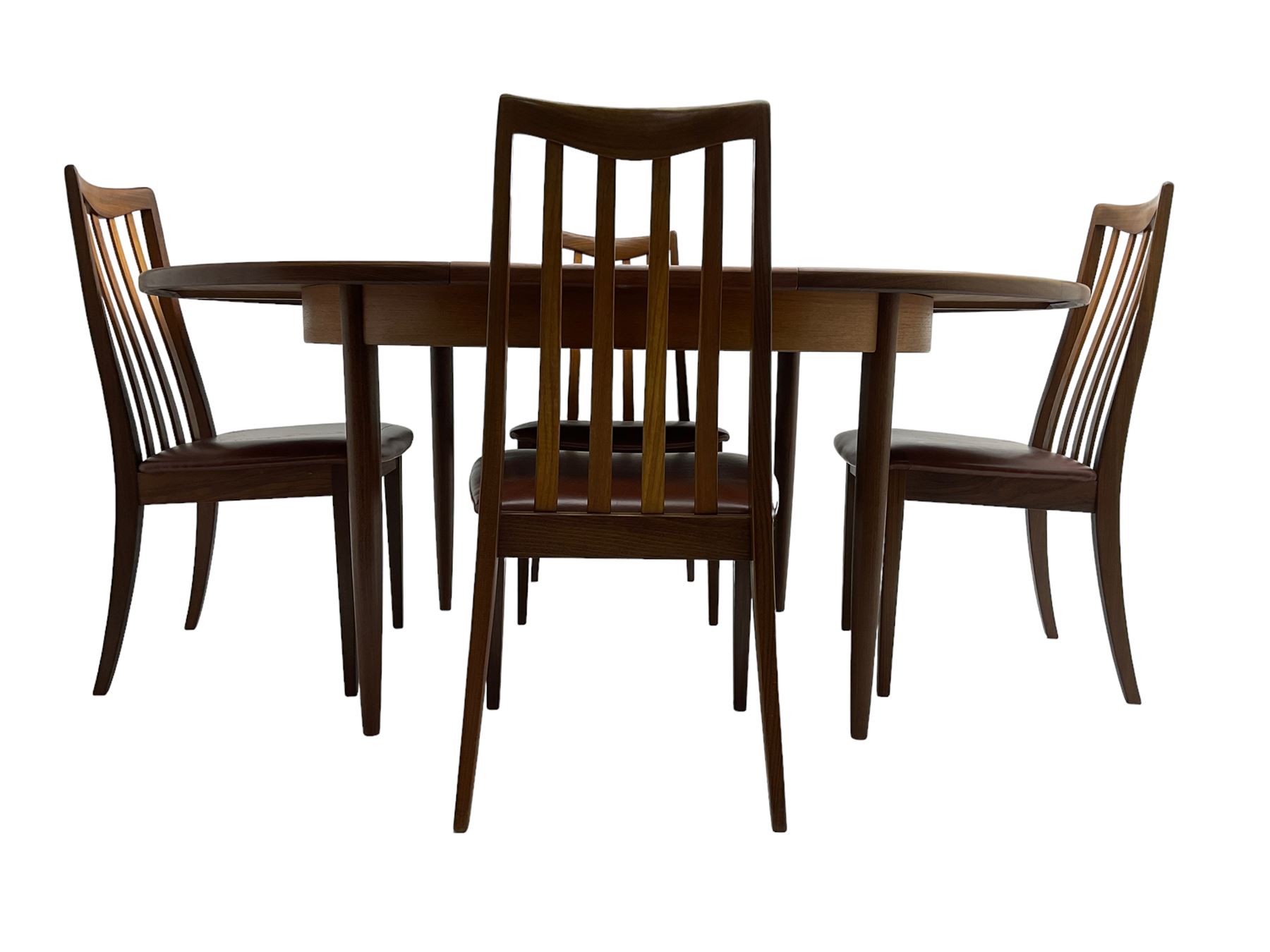 G-Plan - mid-20th century teak 'Fresco' extending dining table, circular top on tapered supports (W122cm H74cm); and Leslie Dandy for G-Plan - set six mid-20th century teak 'Fresco' dining chairs, high backs over tan leatherette seats (W46cm H91cm)