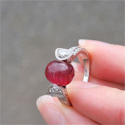 18ct white gold pink tourmaline and diamond ring, single oval cabochon cut tourmaline of approx 4.75 carat, set with a half moon cut diamond either side, to engraved laurel leaf design shoulders