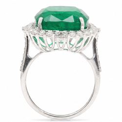 18ct white gold emerald and diamond cluster ring, single cushion cut emerald of approx 13.20 carat, surrounded by round brilliant and baguette cut diamonds and diamond set shoulders, stamped 18K, total diamond weight approx 1.00 carat