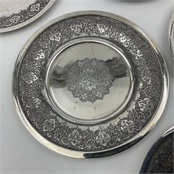 Early/mid 20th century Persian silver tea service, comprising circular serving tray, teapot, twin handled sucrier and cover, milk jug, five tea glasses with six silver holders, six tea spoons, and pair of sugar tongs, each profusely chased with foliate arabesque decoration, each bearing marks including 84 for 840 fineness, tray D40cm, teapot H16cm
