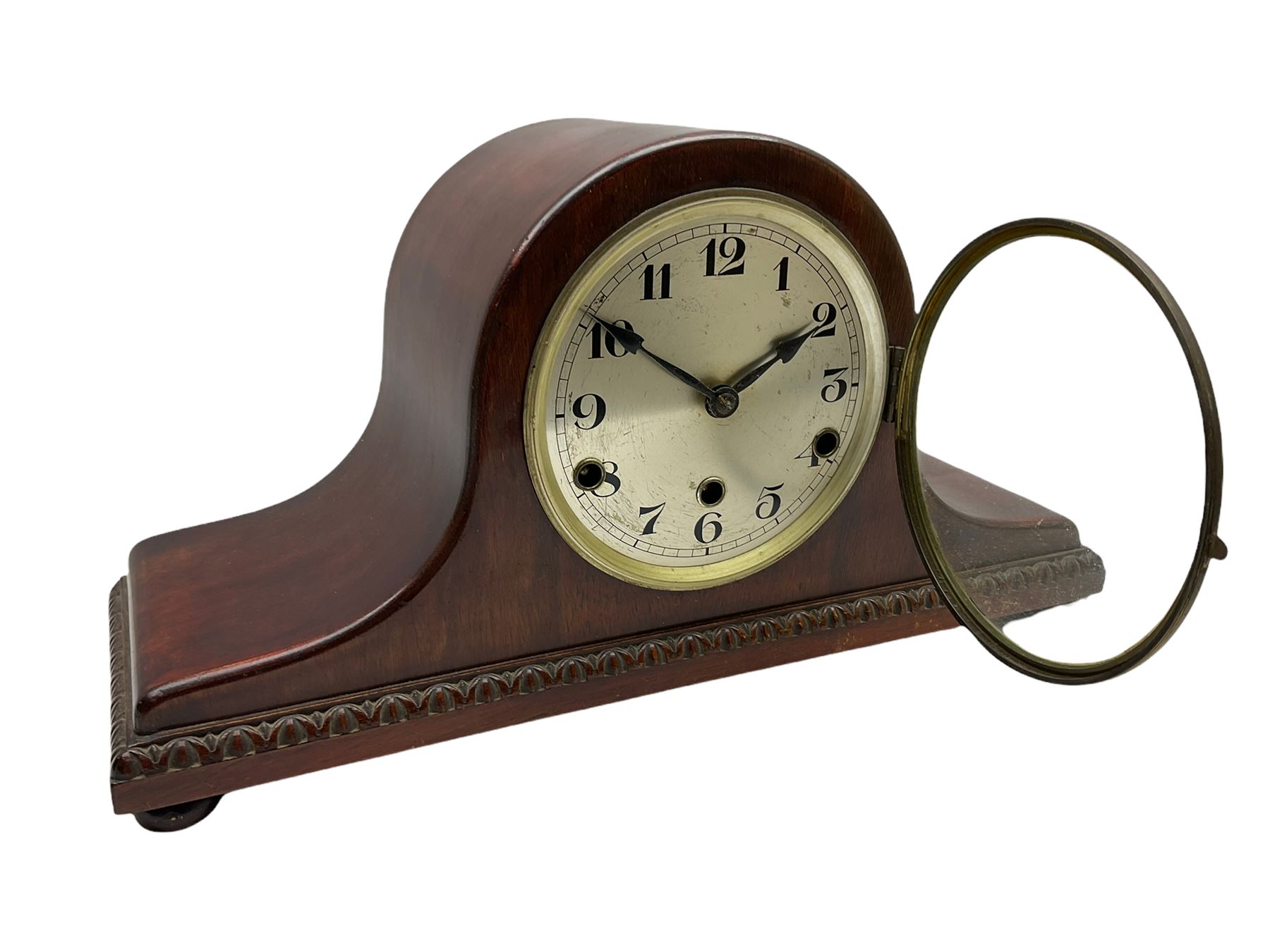 A mahogany cased Tambour clock with a German eight-day movement sounding the quarters and hours on gong rods, with a 6” silvered dial , Arabic numerals and minute track, steel spade hands within a spun brass bezel and convex glass.
With pendulum. 




