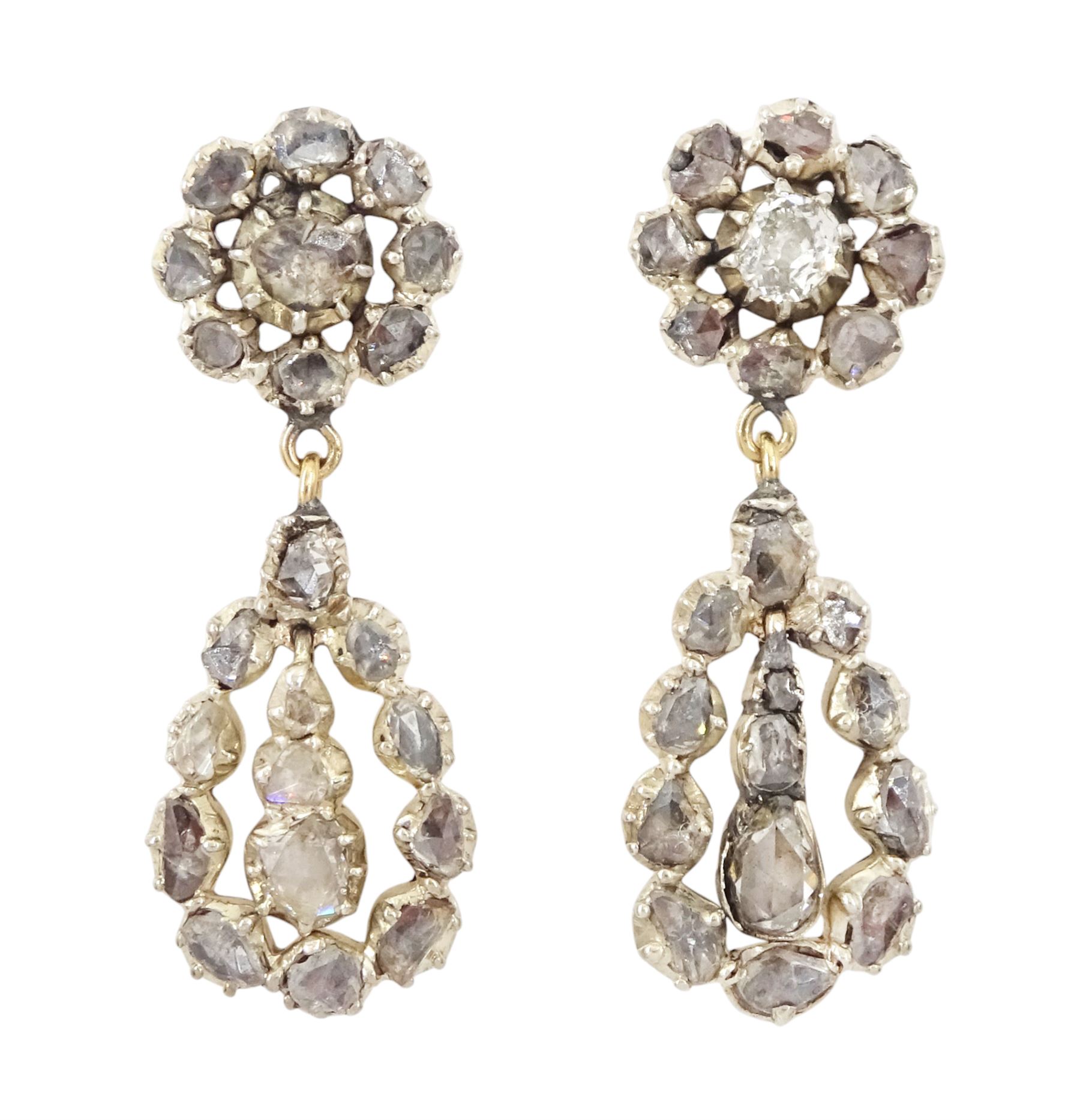 Pair of 19th century gold and silver rose cut diamond pendant earrings, each stud with a pear shaped diamond pendant and drops, suspending from a cluster of diamonds
