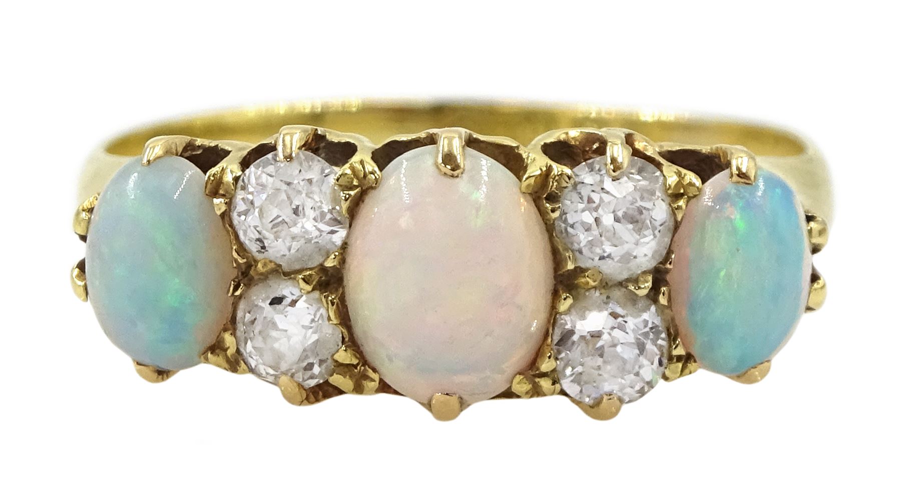 Early 20th century 18ct gold three stone opal, the centre stone set with two old cut diamonds either side, London 1913, total diamond weight approx 0.30 carat