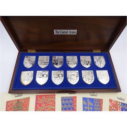 Yorkshire Mint, The Royal Arms Collection, twelve shield shaped silver medallions each depicting variations on the Royal coat of arms, each hallmarked Yorkshire Mint, Birmingham 1976/77, contained within fitted wooden case with associated information cards