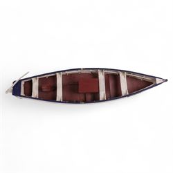 Two wooden fishing coble models, comprising SE31, with rudder, painted in blue, white and red and SSS.33 'Alice', painted in green, black and yellow, largest H16cm, L70cm