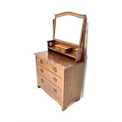 Arts & Crafts period oak dressing chest, raised mirror back with single trinket drawer above three graduating drawers, stile supports