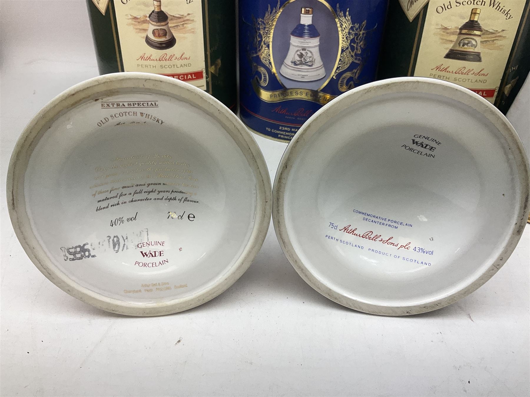 Bells, Scotch whisky, in seven Wade ceramic decanters, comprising two Christmas decanters 1990 and 1991, 60th birthday of Queen Elizabeth II decanter, Golden Wedding anniversary of the Queen and the Duke of Edinburgh decanter, Birth of Princess Beatrice decanter, Birth of Princess Eugenie decanter and Queen's mothers, together with Bells, blended Scotch whiskies, three miniatures in Wade ceramic decanters, various contents and proofs