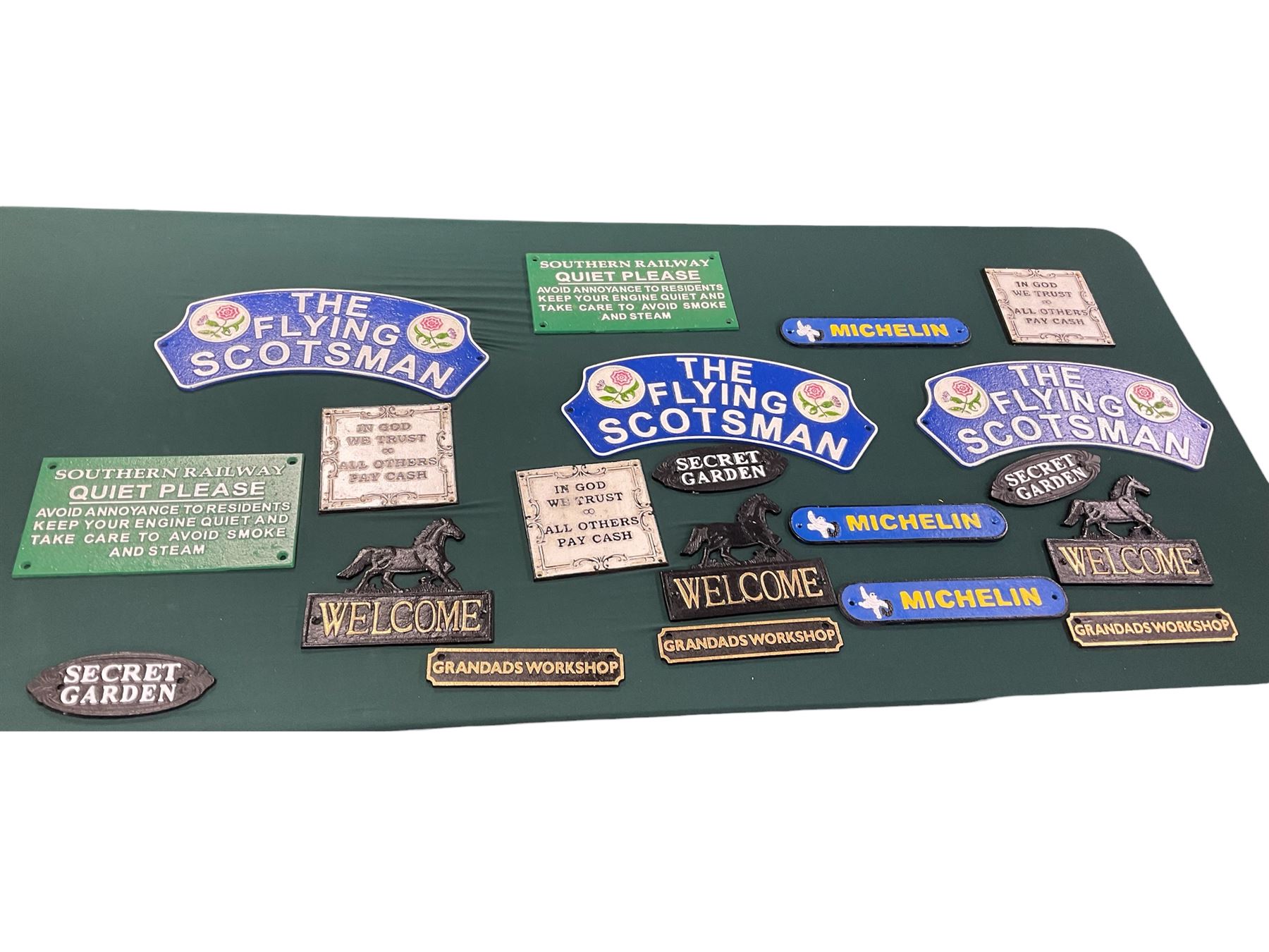 Collection of cast iron signs, including The Flying Scotsman, Quite please, Welcome etc 