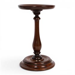 Pair of 19th century turned mahogany candle stands, each with circular top upon a baluster stem and circular stepped base, H25.5cm