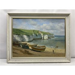 Walter Goodin (British 1907-1992): Cobles at North Landing Flamborough, oil on board signed and dated 1982, 55cm x 75cm